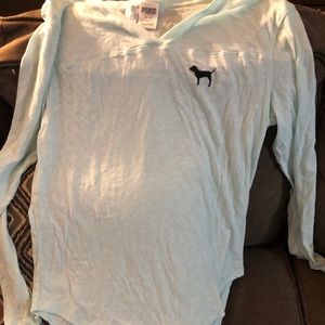 Medium pink shirt greenish blue in color